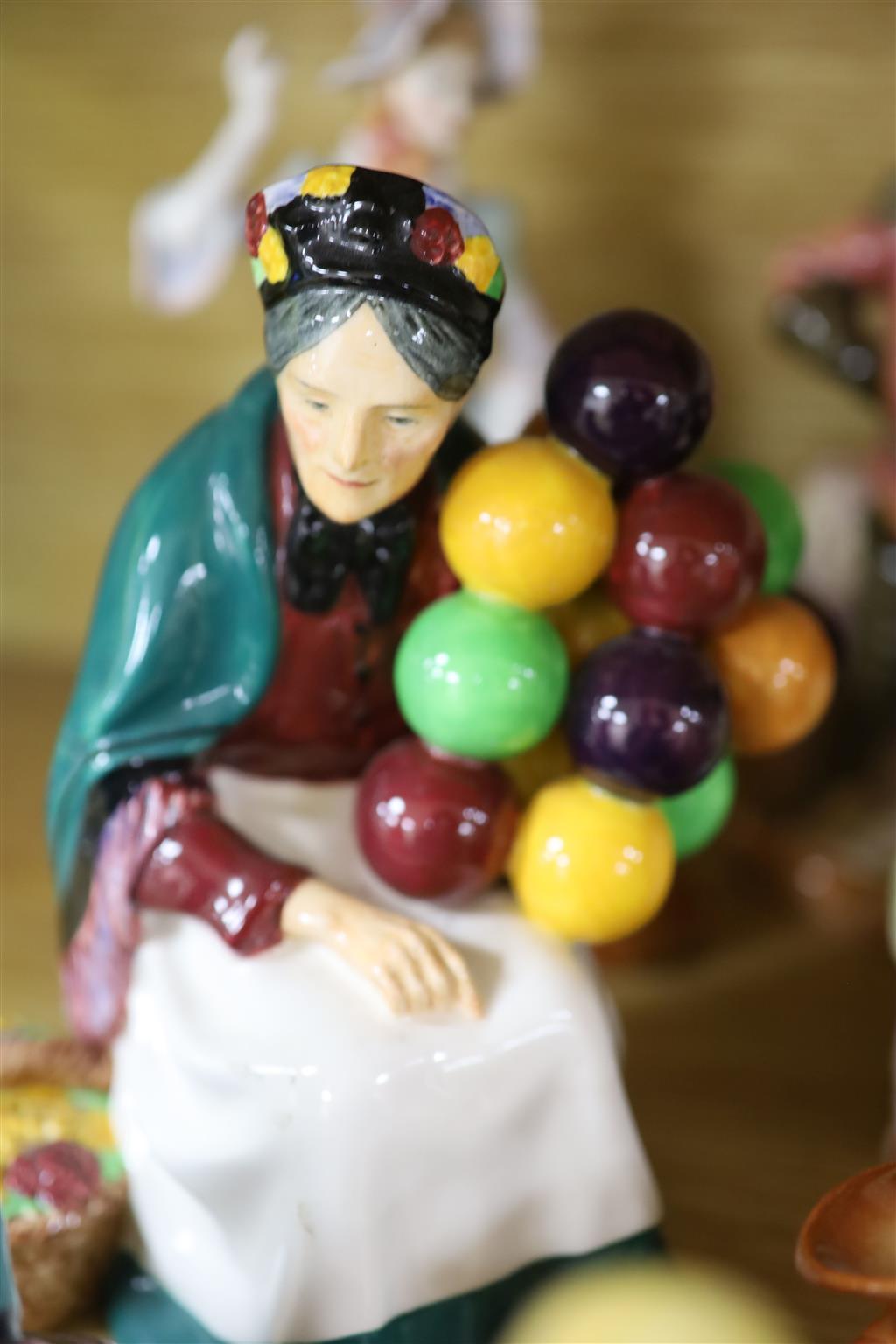 One Royal Doulton balloon seller, three other figurines, plus six character jugs